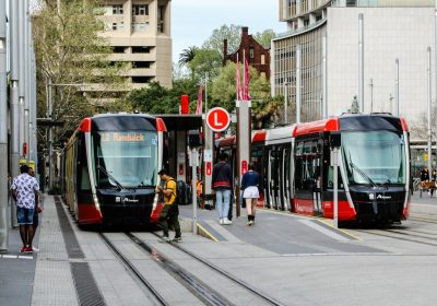 How do tourists pay for public transport in Sydney